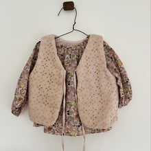 Load image into Gallery viewer, Floral blouse with beige vest on a hanger against a white wall