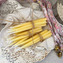 Load image into Gallery viewer, Bundled yellow candles on a lace doily with decorative ribbons .