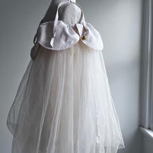Load image into Gallery viewer, ivory dress with tulle on a mannequin against a wall