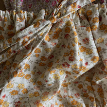 Load image into Gallery viewer, Floral fabric with a pattern of orange and pink flowers on a white background