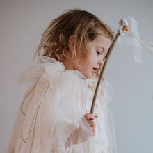 Load image into Gallery viewer, Child in a fairy cape holding a wand against a plain background